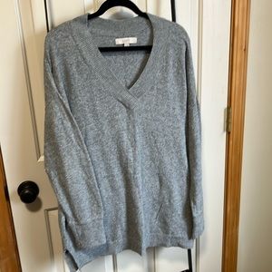 Gray long sleeve sweater fits boxy and has great upper body coverage.